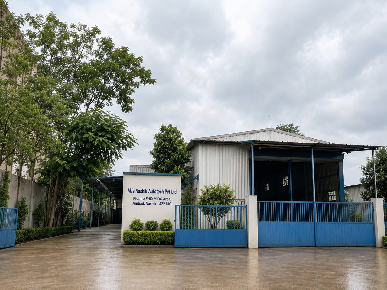 Plant I entrance of Nashik Autotech Pvt. Ltd. at F-60, MIDC Ambad, Nashik, with company name board and blue gates